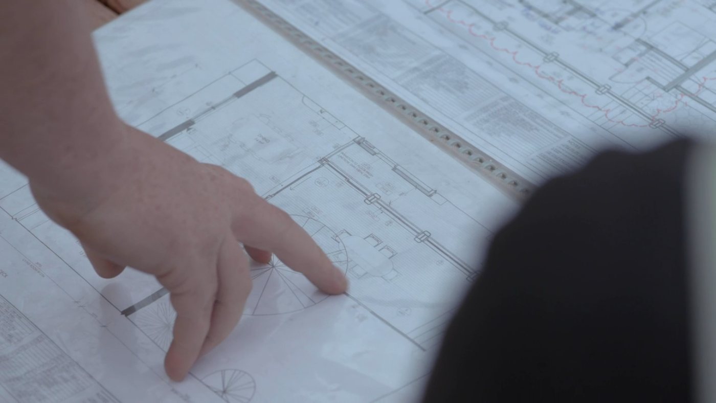 Structural drawings under review on a desk